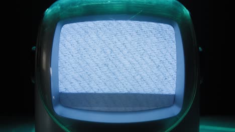 retro tv, vintage television in a nostalgic setup, a retro tv displays grain on screen, scary halloween night device good for chroma key and green screen. high quality 4k footage