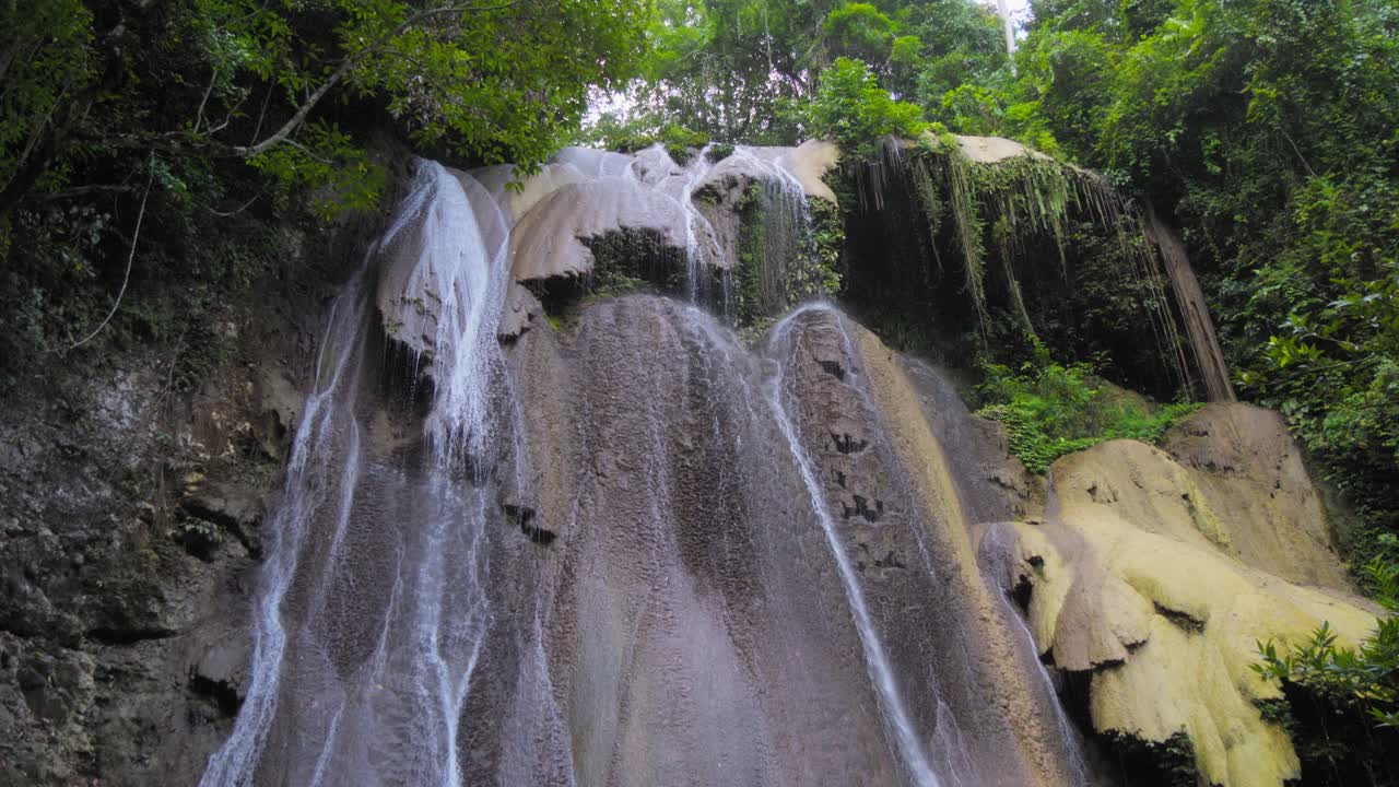 Majestic Waterfall Cascading Through Lush Green Jungle