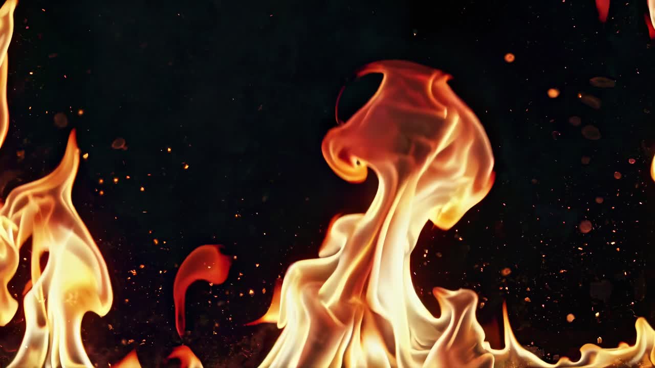 Close-up video of dynamic flames against a dark background, capturing the intense movement