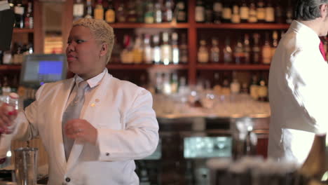 stylish waiter in cocktail bar