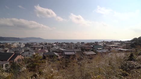 the peaceful town of kamakura with mountains in the background