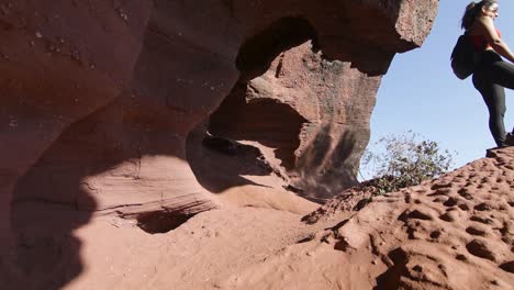 Female-tourist-standing-in-canyon