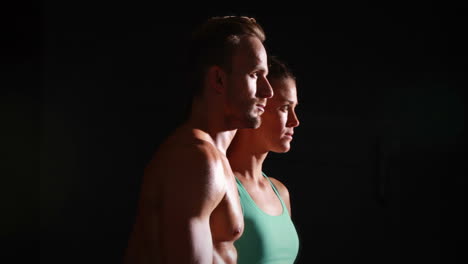 fit man and woman posing