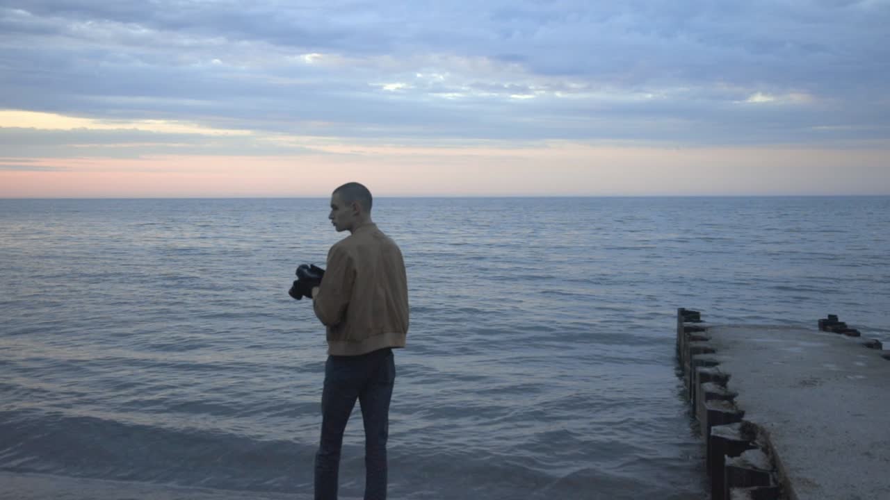 Man Tries To Capture Stunning Sunset Photos With His Camera - medium shot