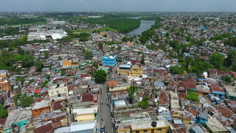 Aerial-4k-view-overlooking-the-Capotillo-cityscape-streets-and-houses,-in-Santo-Domingo,-Dominican-Republic---Dolly,-drone-shot