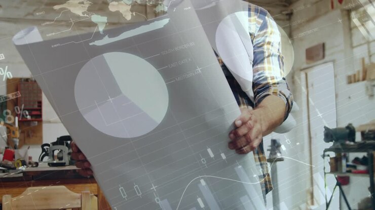 Man looking at plans in the workshop 4k