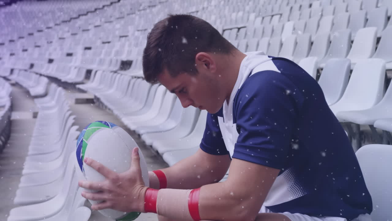 공과 함께 아메리칸 축구 선수 위에 떨어지는 눈의 애니메이션