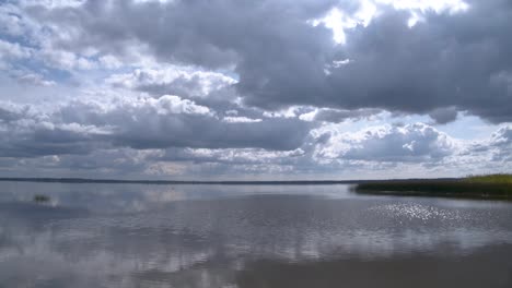 summer clouds over lake time lapse