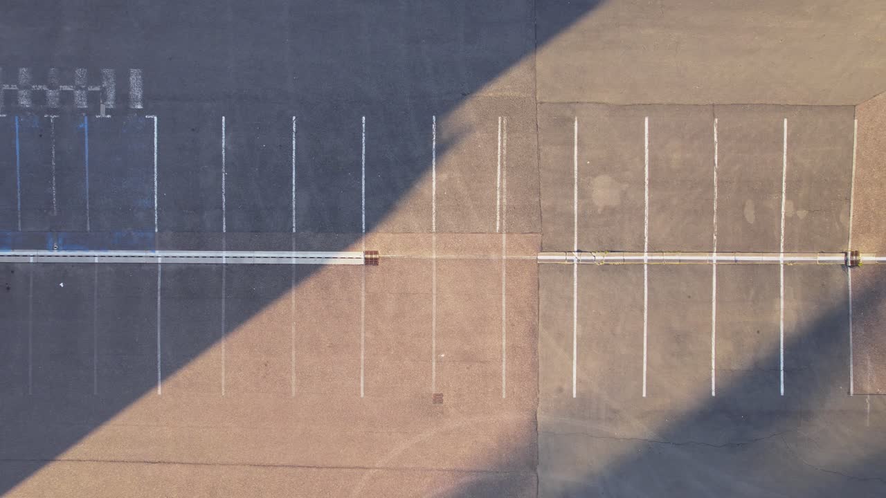 aerial view empty parking lot early morning ghost town