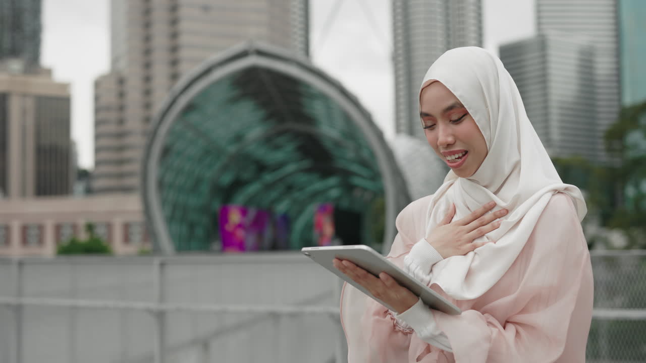 Woman using tablet in a city