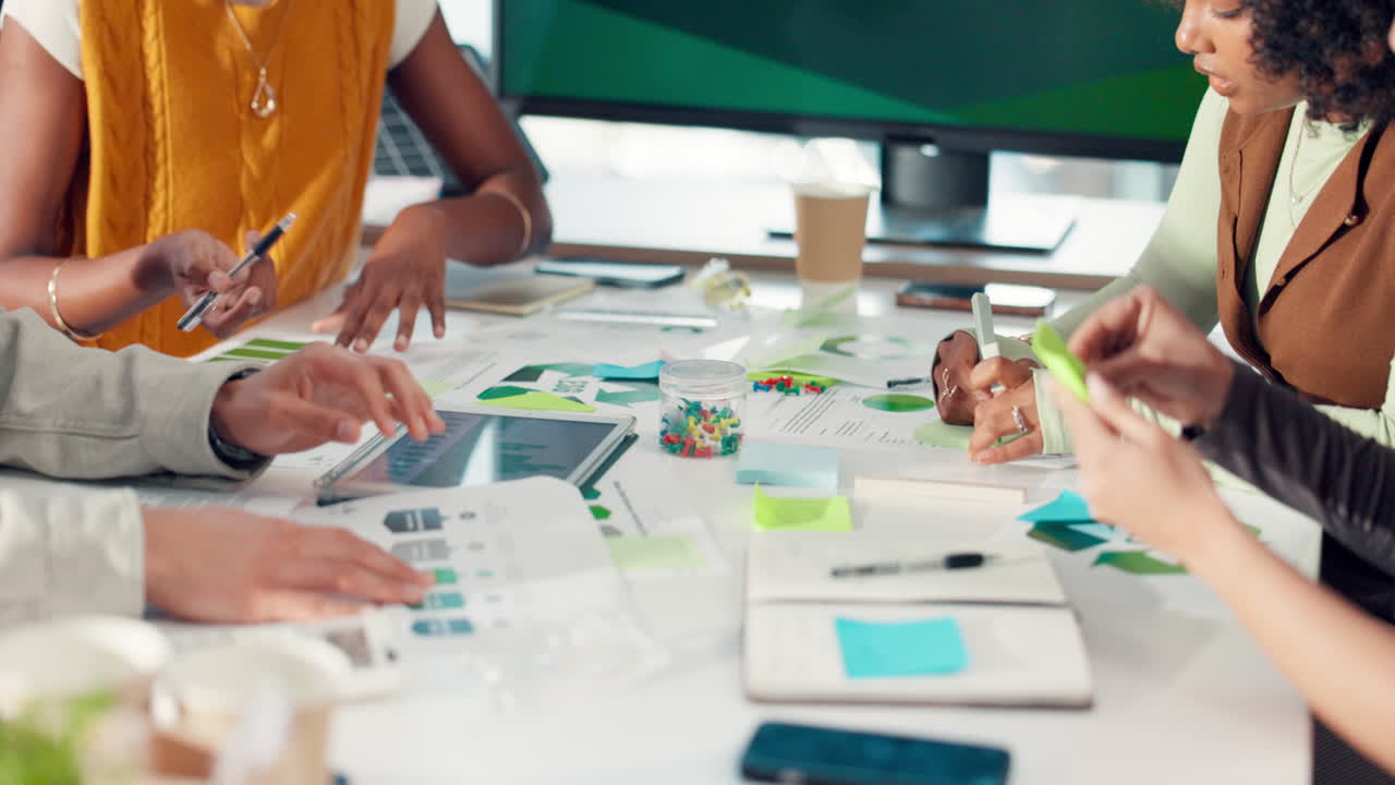 Close-up of Business Team Collaborating on Project in Modern Office