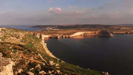 aerial drone video from malta, mellieha area, showing the beautiful landscape on a calm autumn afternoon