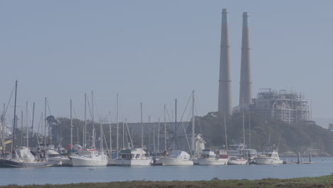 Panning-shot-of-sail-boats-at-harbor-in-Moss-Landing-Harbor-California