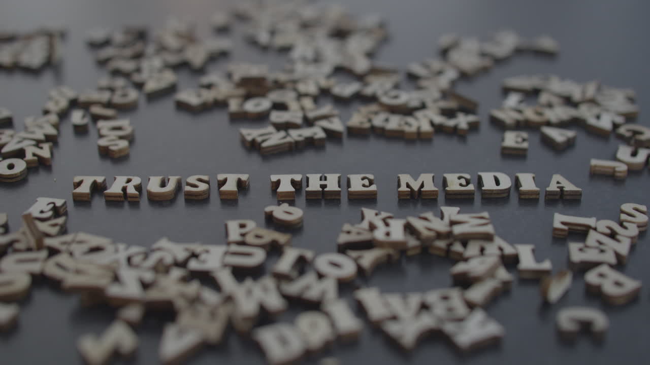 Trust the media title blown to pieces, fake news narrative opposition protest distrust