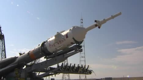 a russian soyuz rocket rises up on the launchpad 1