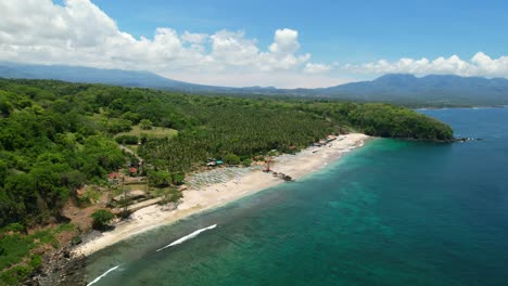 Aerial-coastline-of-tropical-blue-ocean-and-white-sand-beach-in-east-bali-at-Pantai-Prasi