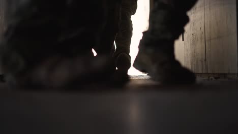 soldiers entering hallway armed