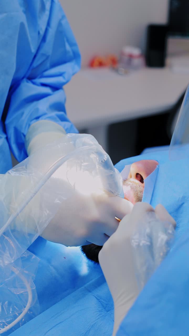 Surgeon performs dental implant procedure with precision in sterile field Europe
