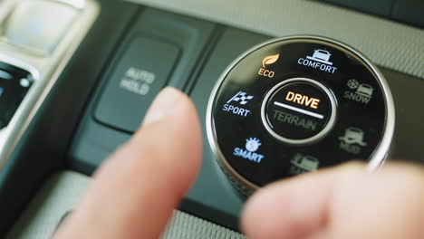 car drive mode selector with fingers