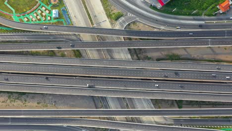 aerial top view of highway, transport city junction road with car on intersection cross road