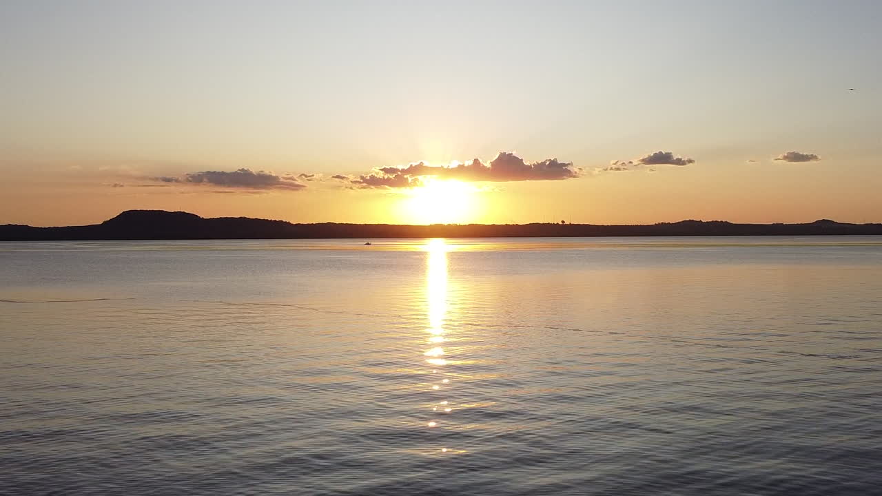 Aerial Shot: Drone going through the lake