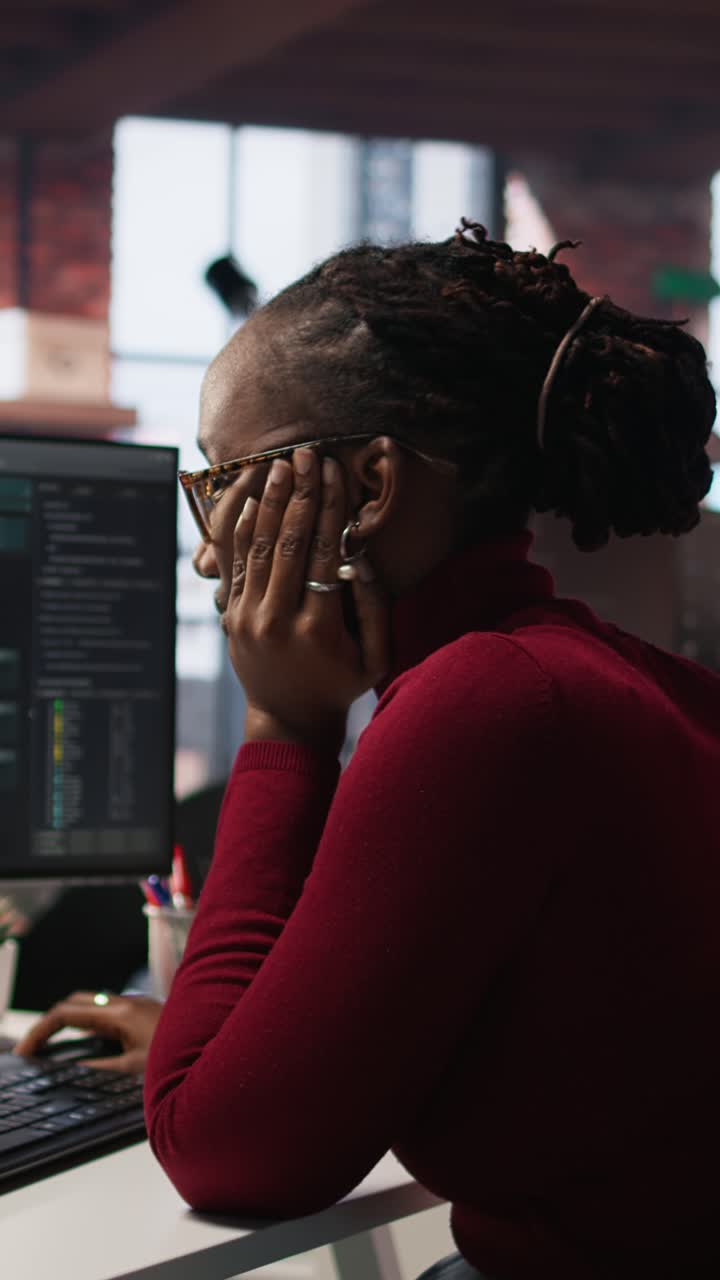 Vertical video Tired overworked admin in AI startup office getting help from senior manger