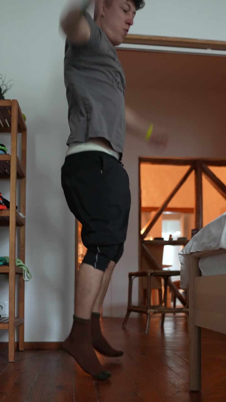 Man Jumping Jacks at Home