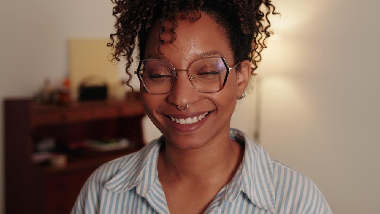 Young African American Woman with curly hair at Home