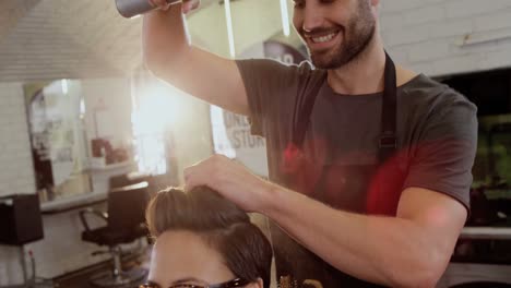 male hairdresser styling customers hair