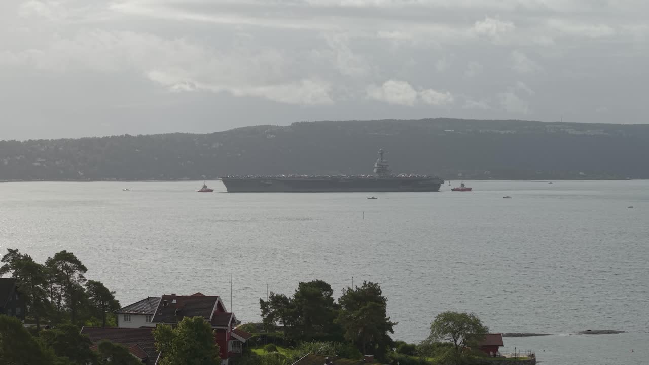 Aircraft Carrier USS Gerald R. Ford Of The United States Navy In Oslo Fjord, Oslo, Norway. - aerial shot