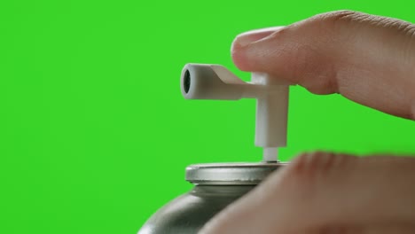 hand pressing spray can