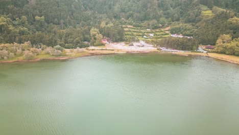 Aerial-panoramic-shot-of-fumaroles-hot-springs-by-Furnas-Lagoon,-Azores-Archipelago