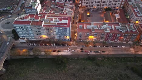aerial view of urban apartment buildings glowing at dusk, highlighting the serene city atmosphere