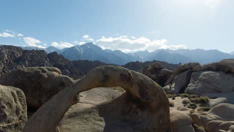 Mobius-Arch-in-the-Alabama-Hills,-eastern-sierra-mountains-in-the-background