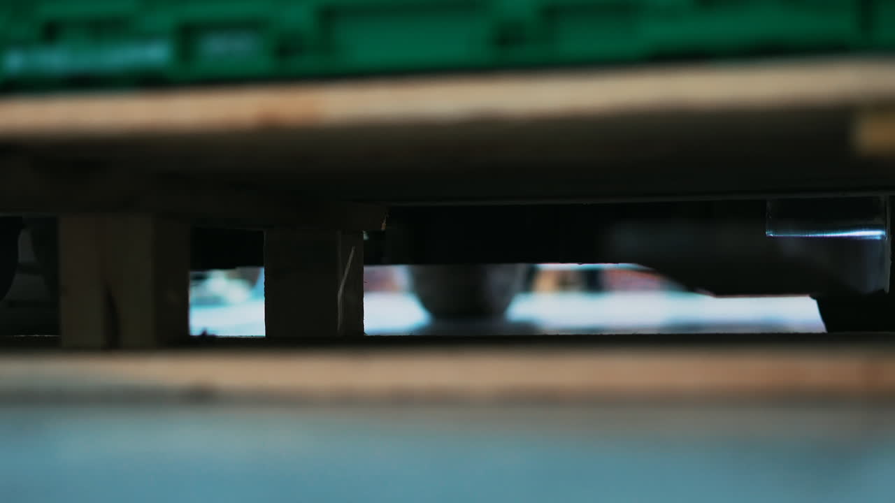 Forklift that lifts a wooden pallet with goods