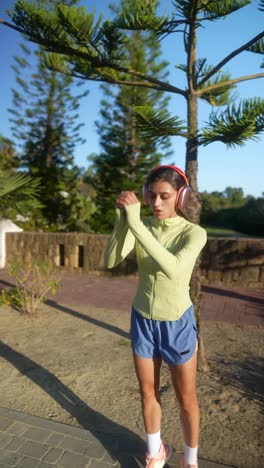 woman jogging outdoors with headphones