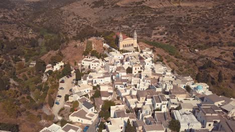 aerial drone shot pulling back slowly over the agricultural village of lefkes greece