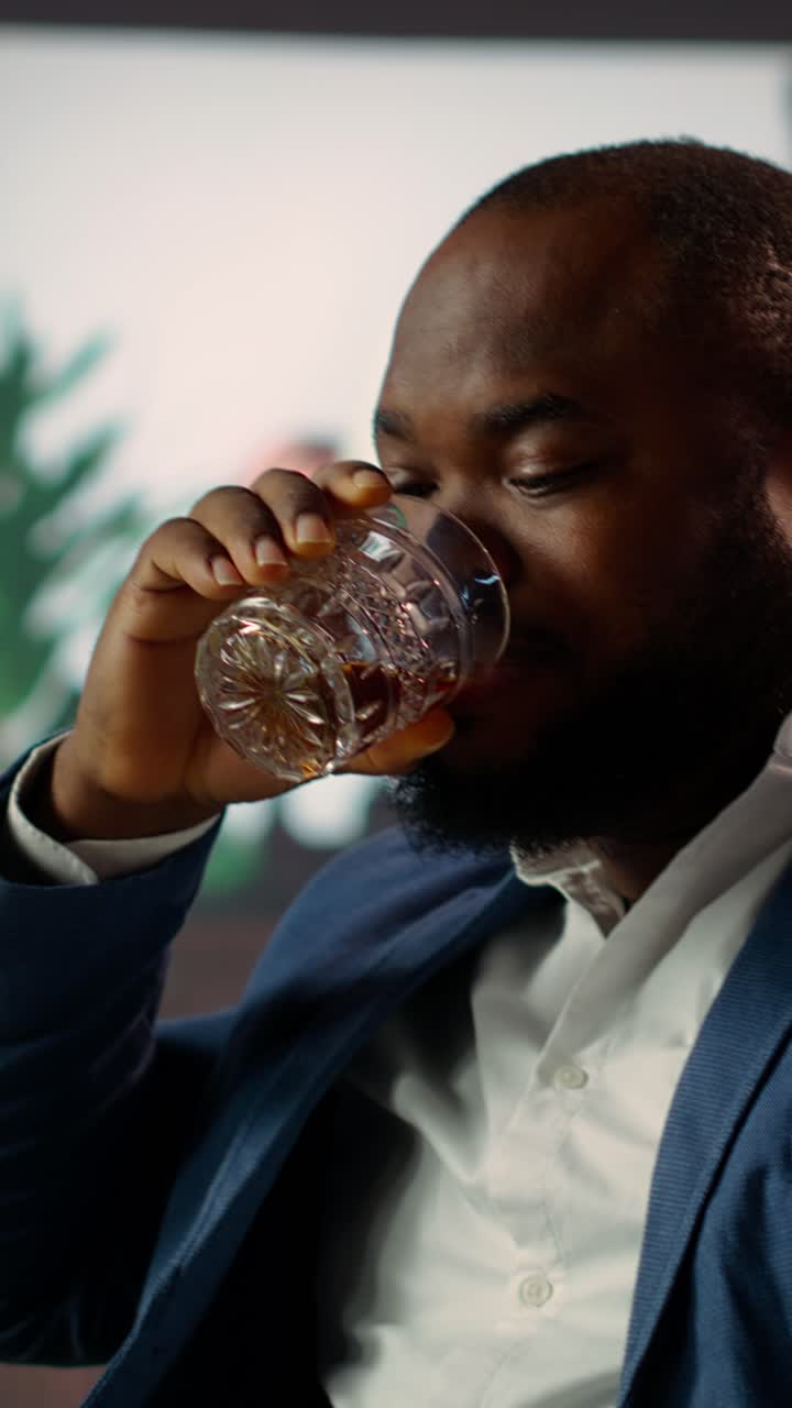 Confident African American Man Sips Whiskey and Speaks