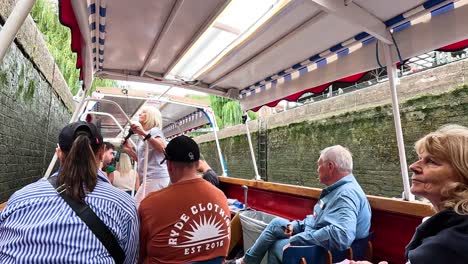 people enjoying a boat ride in london