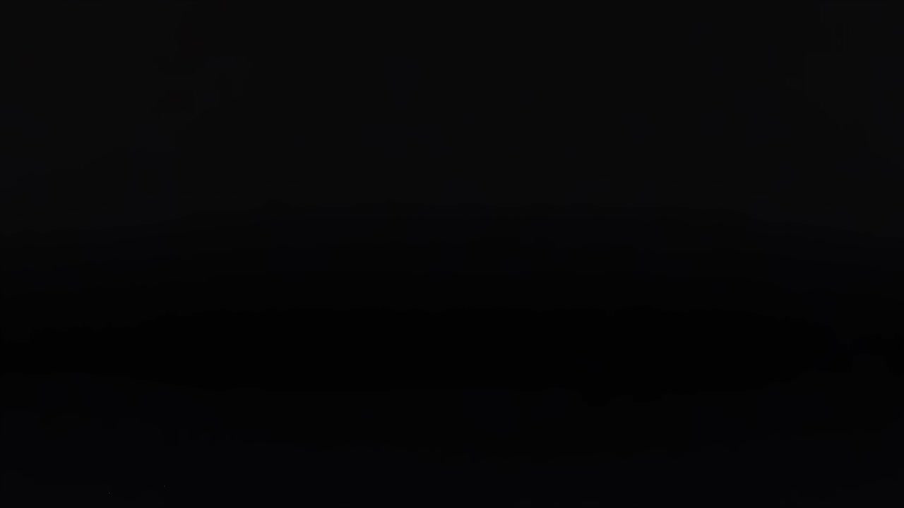 A vibrant pink ball moves vertically against a dark background, creating a rhythmic pattern.