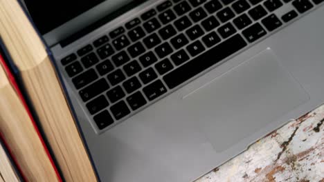 spectacles, books, laptop and camera