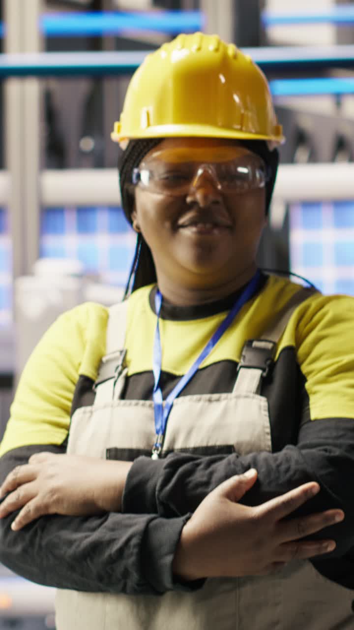 Vertical video Portrait of smiling technician in industrial plant working to diagnose equipment
