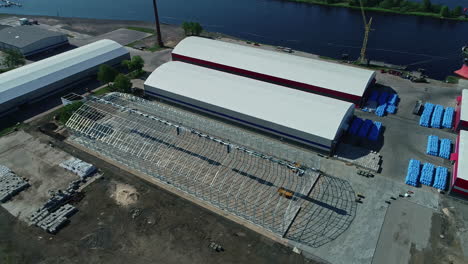 construction site of grain warehouse near old ones, aerial drone view