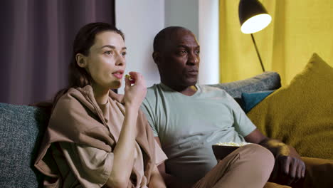 couple watching film at home