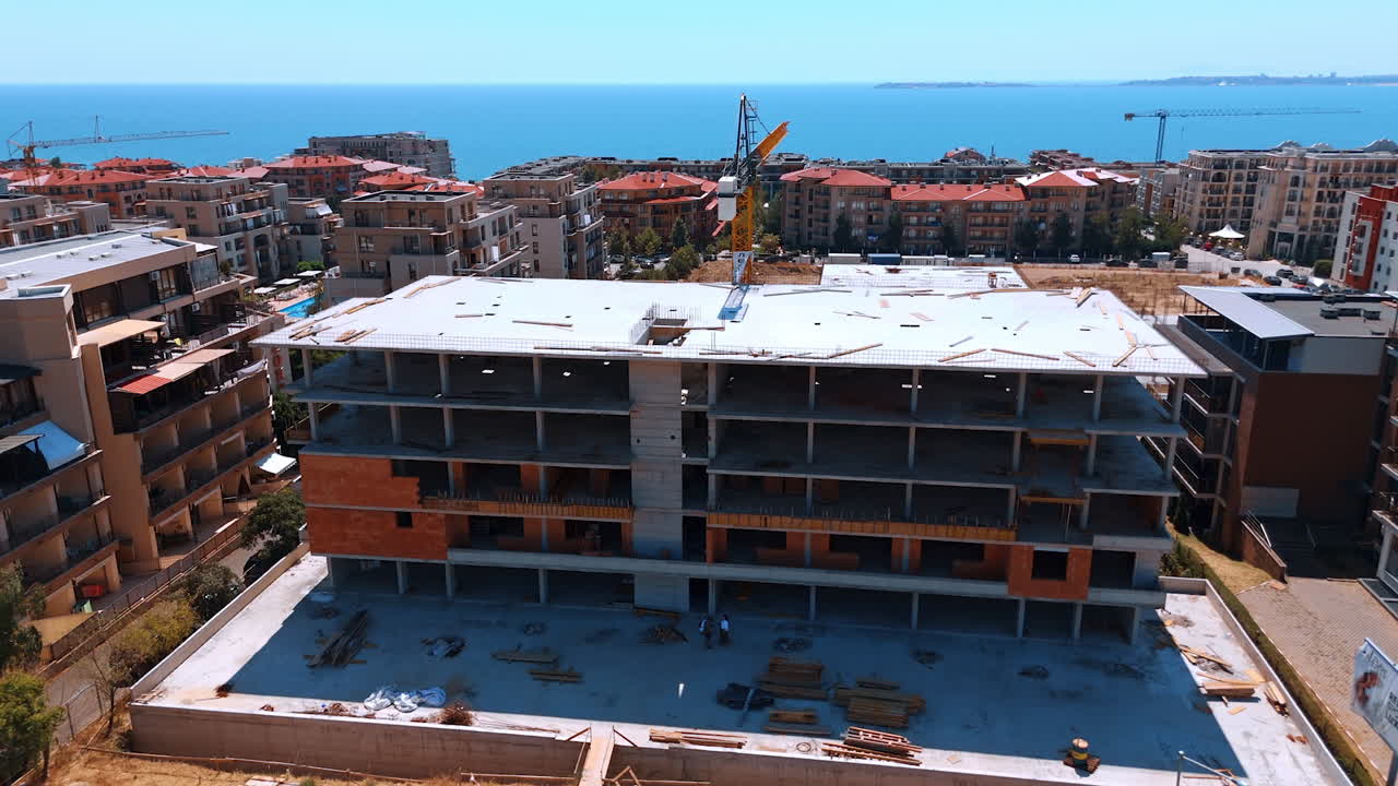 New coast home under construction. Construction of a multi-story residential building near the coast, showcasing modern design and scenic views of the sea
