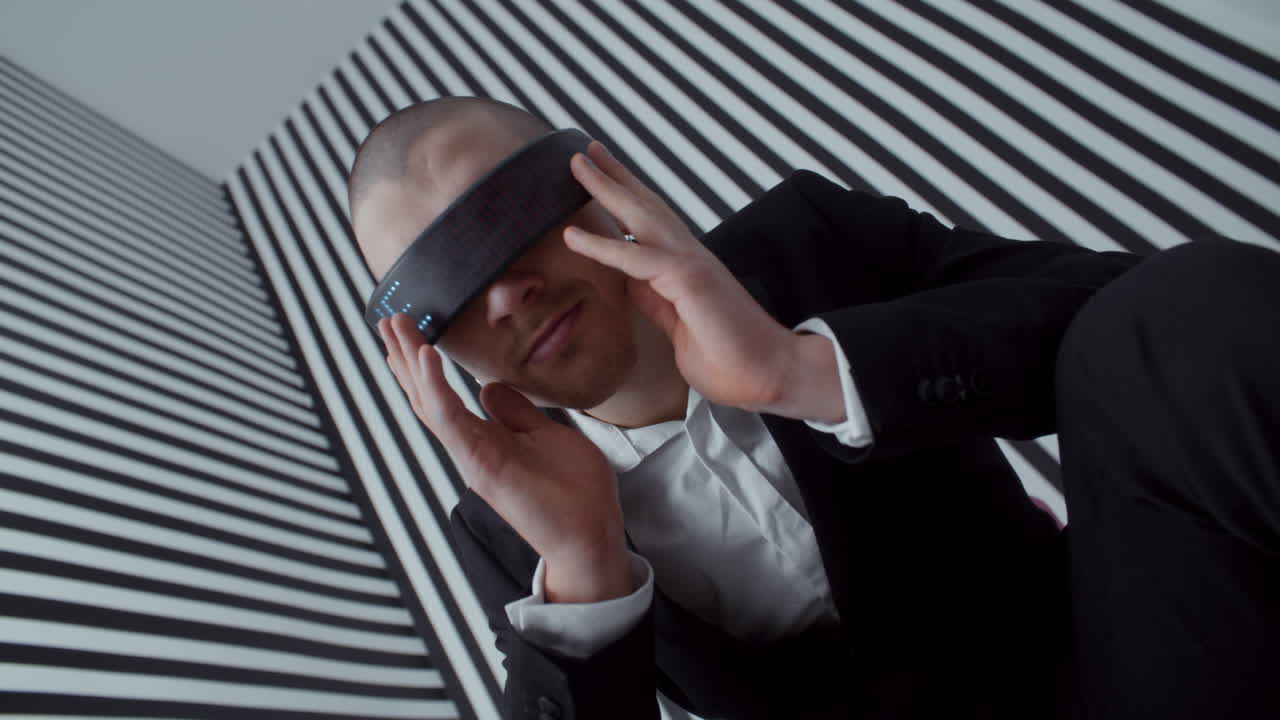 Man with LED Glasses in Abstract Setting