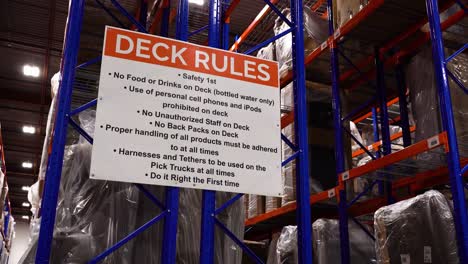 deck rules steel warehouse distribution center racking shelves product inventory interior furniture storage metal blue orange industrial equipment business logistics empty transportation sales