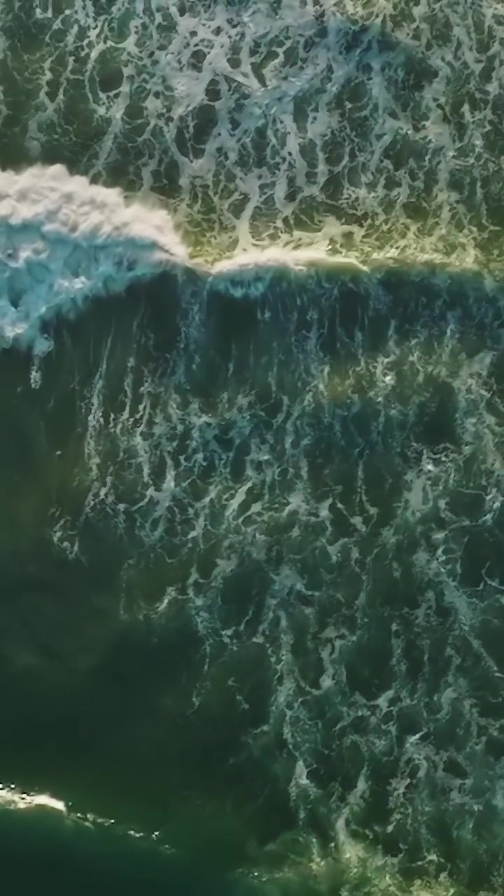 Waves roll towards the shore in California during a sunny day