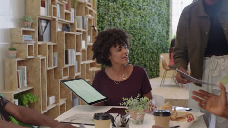 black business people meeting brainstorming team leader woman presenting finance data using tablet technology sharing project strategy colleagues working together in office boardroom