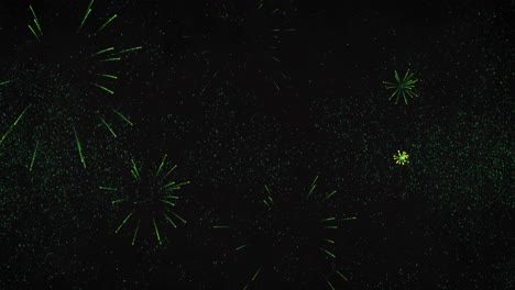 Animation of new year&#039;s eve greetings and green fireworks exploding on black background